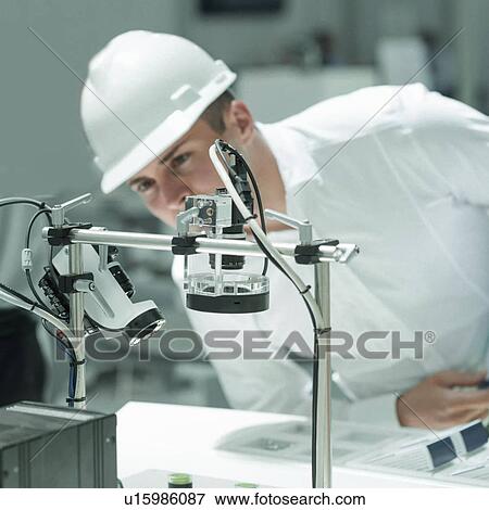 Stock Photo - Engineer working in factory. Fotosearch