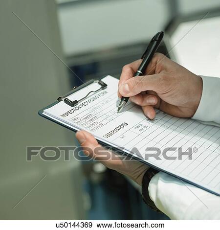 Stock Photo - Engineer working in factory. Fotosearch