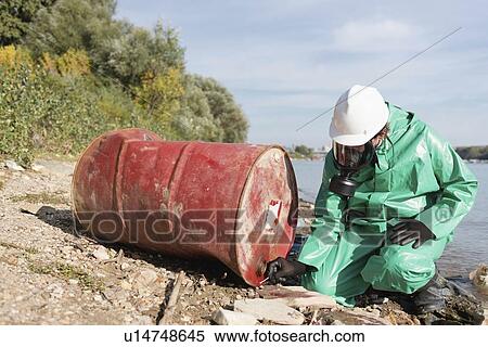 Stock Photography - Examination of chemical leak. Fotosearch