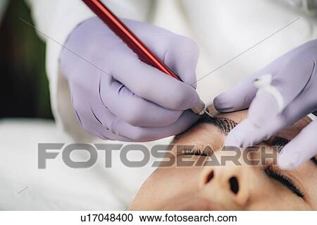 Stock Image - Eyebrow microblading. Fotosearch