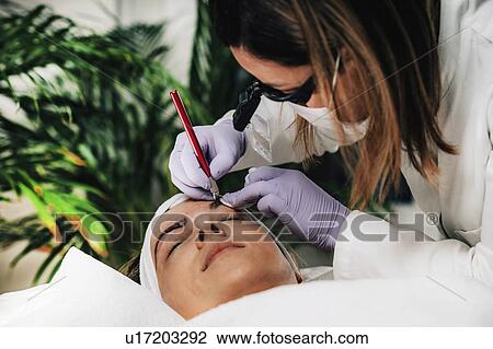 Stock Image - Eyebrow microblading. Fotosearch