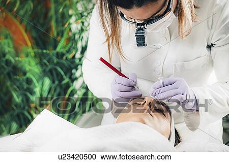 Stock Image - Eyebrow microblading. Fotosearch