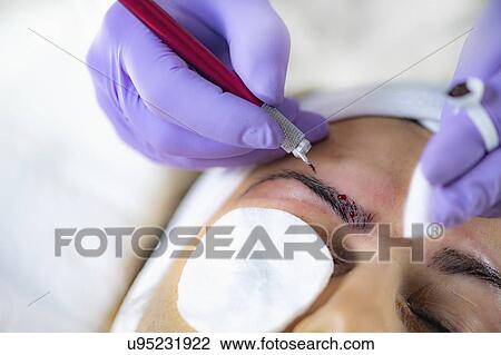 Stock Image - Eyebrow microblading. Fotosearch
