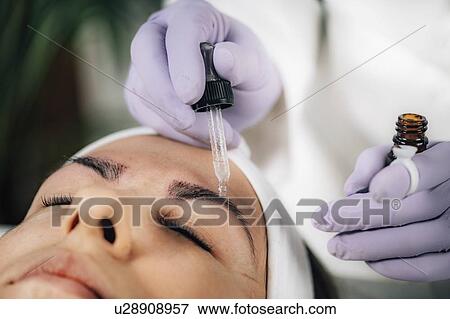 Stock Photo - Eyebrow microblading. Fotosearch