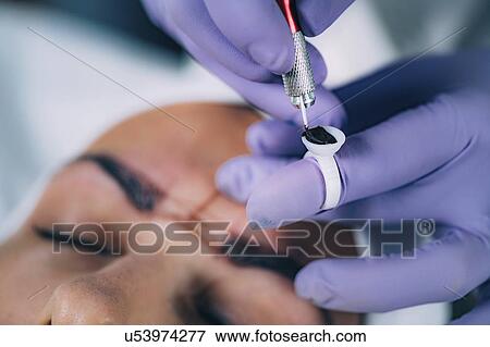 Stock Photo - Eyebrow microblading. Fotosearch