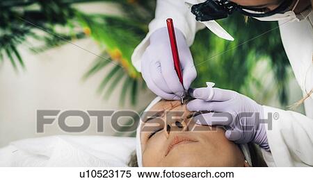 Stock Photography - Eyebrow microblading. Fotosearch