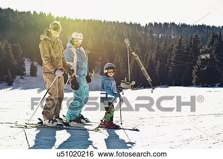 Stock Photograph - Family on skiing holiday. Fotosearch
