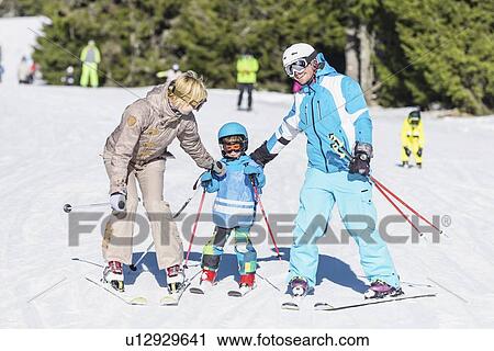 Family skiing View Large Photo Image Stock Image - Family skiing. Fotosearch