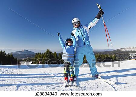 Father and son skiing View Large Photo Image Stock Image - Father and son skiing. Fotosearch