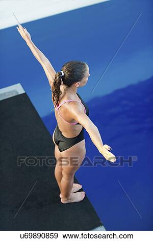 Stock Photo - Female diver on platform. Fotosearch