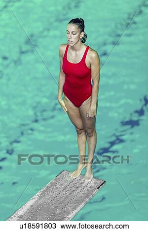 Stock Image - Female diver on springboard. Fotosearch