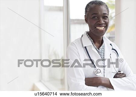Picture - Female doctor smiling. Fotosearch