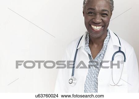 Female doctor smiling View Large Photo Image Picture - Female doctor smiling. Fotosearch