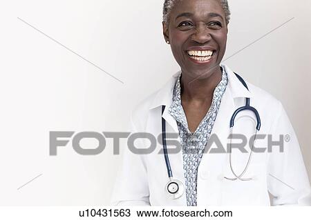 Stock Image - Female doctor smiling. Fotosearch