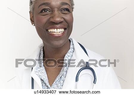 Stock Photo - Female doctor smiling. Fotosearch