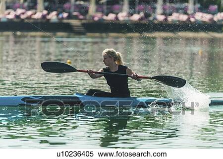 Stock Photography - Female kayaker. Fotosearch