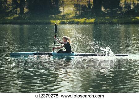 Stock Photography - Female kayaker. Fotosearch