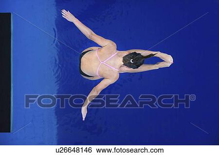 Stock Photograph - Female platform diver. Fotosearch