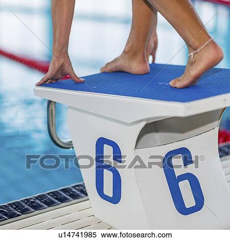 Female swimmer on starting block View Large Photo Image Stock Photography - Female swimmer on starting block. Fotosearch