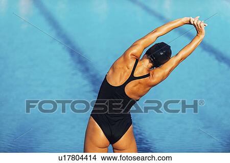 Female swimmer warming up View Large Photo Image Picture - Female swimmer warming up. Fotosearch