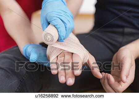 Stock Image - First aid training for burns. Fotosearch