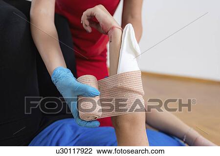 Stock Image - First aid training for burns. Fotosearch