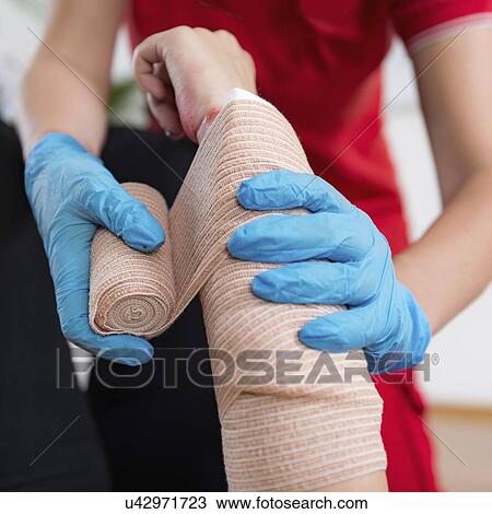 Stock Image - First aid training for burns. Fotosearch