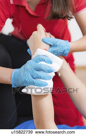 Stock Photo - First aid training for burns. Fotosearch