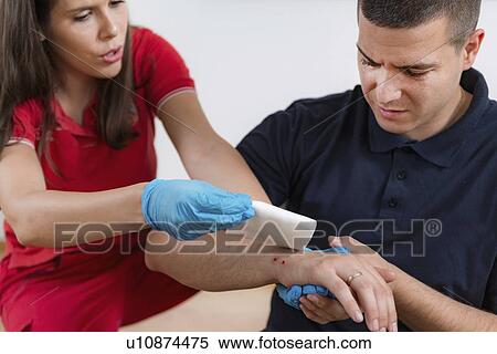 Stock Photography - First aid training for burns. Fotosearch