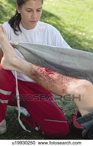 First aid treatment of injured patient View Large Photo Image Stock Image - First aid treatment of injured patient. Fotosearch