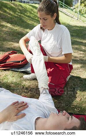 First aid treatment of injured patient View Large Photo Image Stock Photograph - First aid treatment of injured patient. Fotosearch