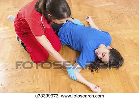 Stock Image - Food poisoning first aid training. Fotosearch