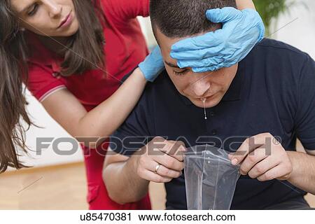 Stock Image - Food poisoning first aid training. Fotosearch