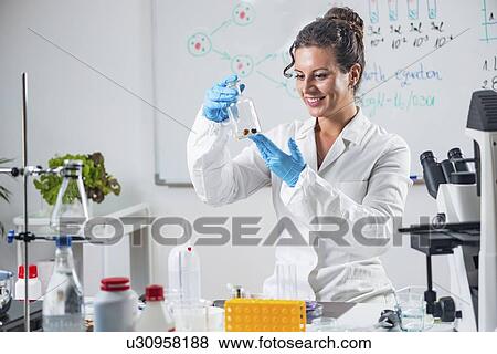 Stock Photo - Food safety inspector working in laboratory. Fotosearch