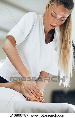 Foot massage View Large Photo Image Stock Photo - Foot massage. Fotosearch