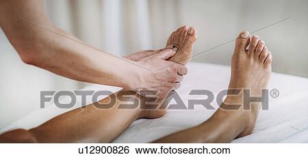 Stock Photograph - Foot massage. Fotosearch