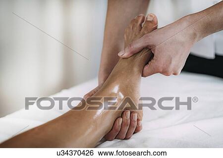 Foot massage View Large Photo Image Stock Photograph - Foot massage. Fotosearch