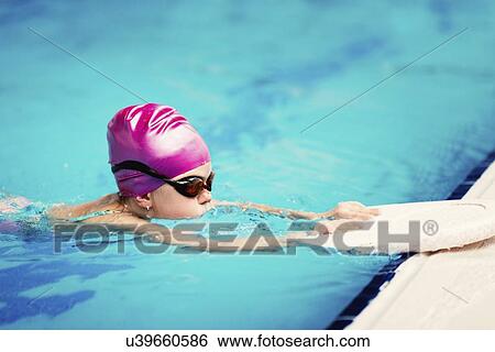Girl learning to swim View Large Photo Image Stock Photograph - Girl learning to swim. Fotosearch