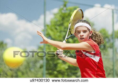 Girl playing tennis View Large Photo Image Stock Image - Girl playing tennis. Fotosearch