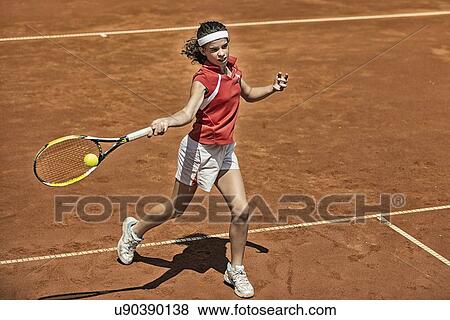 Stock Photo - Girl playing tennis. Fotosearch
