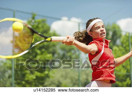 Stock Photography - Girl playing tennis. Fotosearch