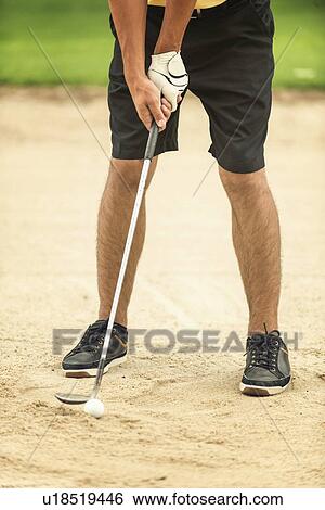 Golfer playing from sand trap View Large Photo Image Stock Photograph - Golfer playing from sand trap. Fotosearch