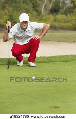 Golfer reading the green View Large Photo Image Stock Photography - Golfer reading the green. Fotosearch