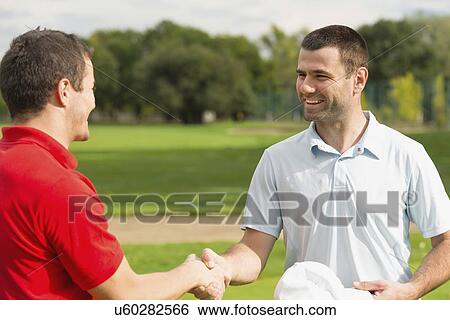Golfers shake hands View Large Photo Image Stock Photograph - Golfers shake hands. Fotosearch