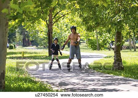 Grandfather and grandson roller skating View Large Photo Image Picture - Grandfather and grandson roller skating. Fotosearch