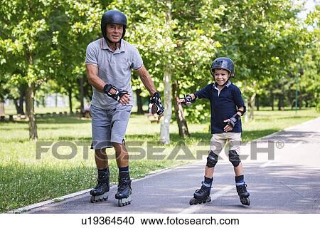 Grandfather and grandson roller skating View Large Photo Image Stock Image - Grandfather and grandson roller skating. Fotosearch