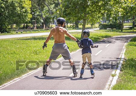 Grandfather and grandson roller skating View Large Photo Image Stock Image - Grandfather and grandson roller skating. Fotosearch