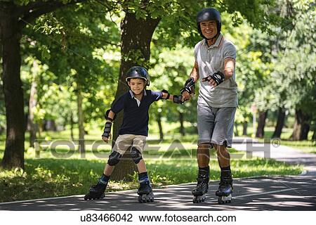 Grandfather and grandson roller skating View Large Photo Image Stock Image - Grandfather and grandson roller skating. Fotosearch