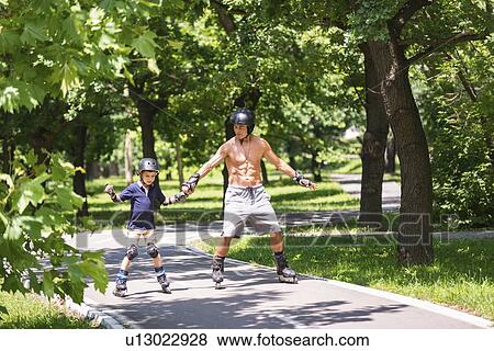 Grandfather and grandson roller skating View Large Photo Image Stock Photo - Grandfather and grandson roller skating. Fotosearch