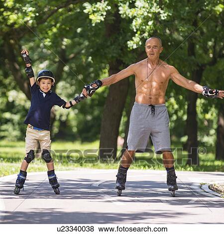 Grandfather teaching grandson to roller skate View Large Photo Image Stock Photo - Grandfather teaching grandson to roller skate. Fotosearch